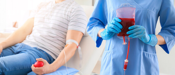 Man donating blood in hospital