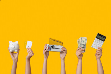 Female hands with cash counting machine, money, piggy bank and calculator on yellow background