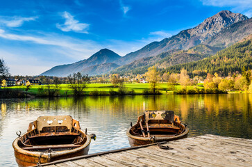 Idyllic mountain lake view with rowboats
