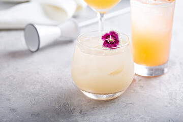 Elegant cocktail with floral garnish