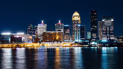 Louisville skyline at night reflecting on water