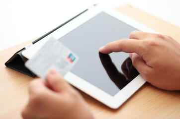 Online shopping with tablet and credit card