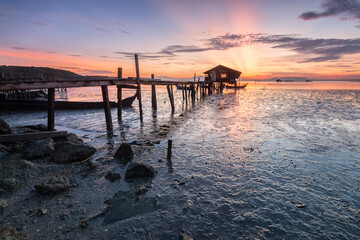 Serene sunset at rustic fishing pier