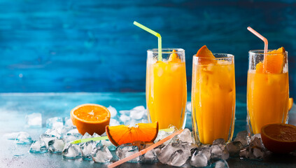 Refreshing orange cocktail on ice