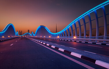 Modern bridge illuminated at twilight