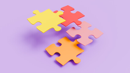 Four yellow, red, orange and purple puzzle pieces in isolated setting, teamwork and togetherness