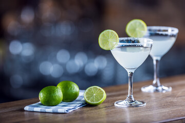 Classic margarita cocktail presentation with limes