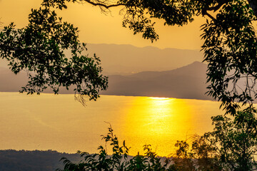 Wallpaper blurred nature of the twilight light in the evening by the large water basin surrounded...