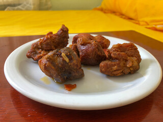 fried pork served on white porcelain plate