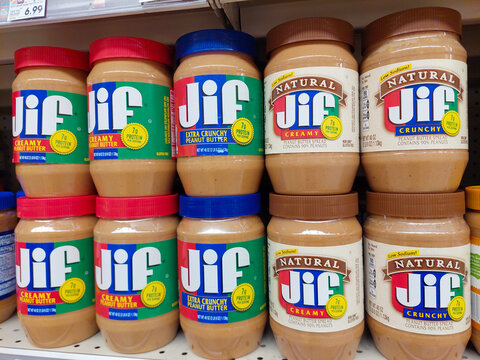 Los Angeles, California &ndash; May 9, 2024: JIF Peanut Butter Spread jars on a shelf in a supermarket. JIF is a brand of The J.M. Smucker Company