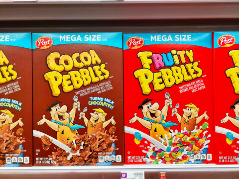 Los Angeles, California &ndash; May 9, 2024: POST Cereals, Cocoa Pebbles and Fruity Pebbles on a shelf in a supermarket. Post Consumer Brands is an American consumer packaged goods food