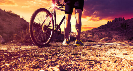 Sunset cycling adventure on mountain trail