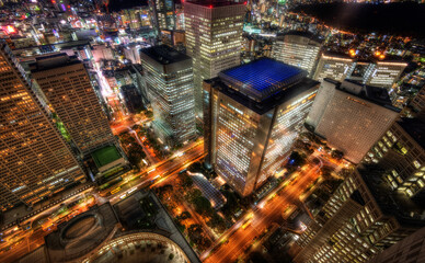 City lights: aerial night view of a bustling metropolis