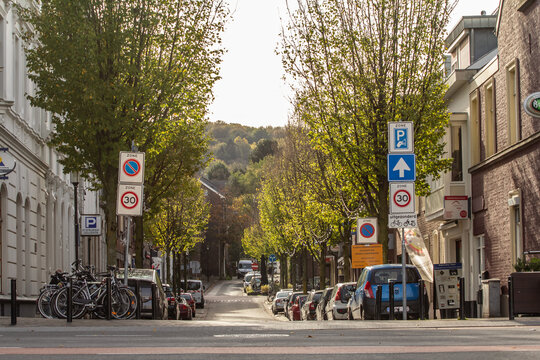 VAALS, NETHERLANDS - NOVEMBER 6, 2022: Panorama of a typical suburban dutch street in a countryside village of the netherlands, called Vaals, in Limburg, with houses and residential buildings in the v