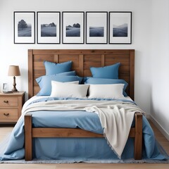 Rustic wooden bed with blue pillows and two bedside cabinets against white wall with three posters frames. Farmhouse interior design of modern 