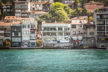 Residential houses on the Bosphorus strait in Istanbul, Turkey, in a residential district of the city, by the marmara sea, in a high real estate development area. Istanbul is the biggest city if Turke
