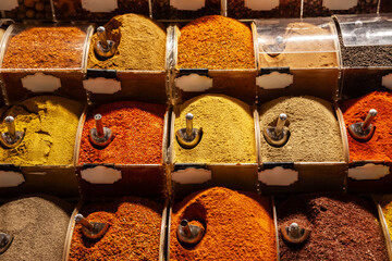 Selective blur on piles of spices of various colors and tastes, used in turkish food, in Istanbul...