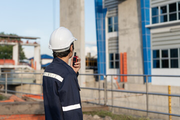 maintenance and inspector. Maintenance engineers are using walky talky to inform the results of...