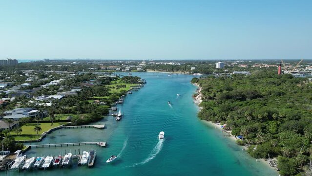 Boats heading out to sea from the intracoastal waterway near Jupiter Inlet in Palm Beach County, Florida