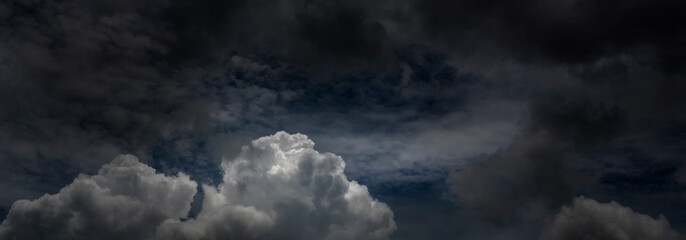 Banner Dramatic dark storm clouds black sky background. Dark thunderstorm clouds rainny season....