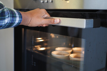cooking brown cupcakes. Baking in oven. 