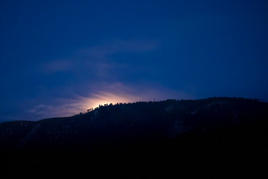 background moonrise over Catalina mountains Arizona