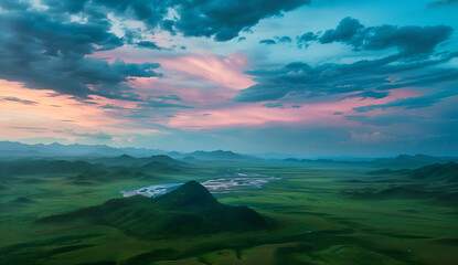 
The sky is full of dark clouds, with the setting sun casting long shadows on distant hills and mountains. The sky gradually turns from blue to orangered as dusk falls. In front of it lies an endless 