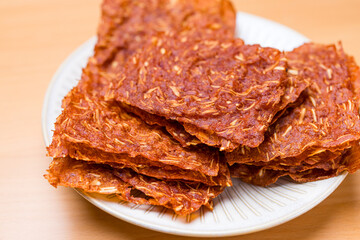 Close up sliced sheets of dried sweet pork