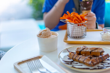 ice cream cup on table with deserts