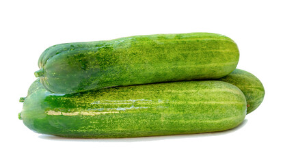 Side view of fresh green cucumbers in stack isolated with clipping path and shadow in png file format