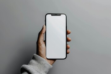 A sleek, minimalistic mockup featuring a hand holding a black iPhone 16 Pro with a transparent screen cutout in green and grey tones. - Powered by Adobe