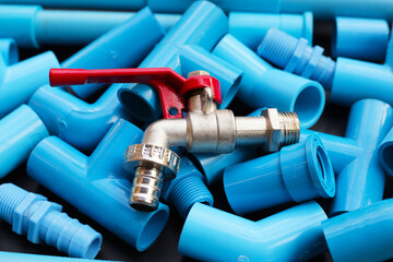 Plumber equipment with blue pvc pipe connections for plumbing work.