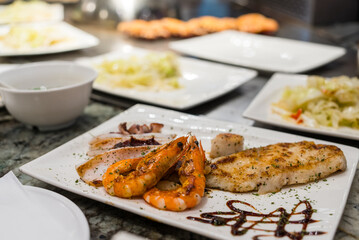 Teppanyaki in Taiwan restaurant, grilling shrimp and squid