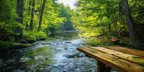 Obraz premium Riverside Desk in New England: A peaceful desk overlooking a river, surrounded by lush greenery and towering trees, offering a tranquil work environment and stunning natural views