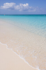 white sand beach with clear calm turquoise water