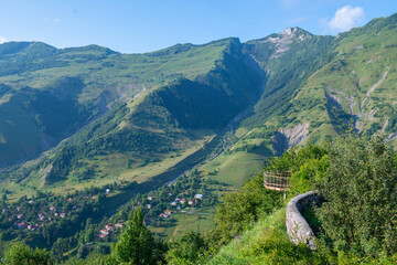 Verdant Majesty: Green Mountains against a Blue Backdrop