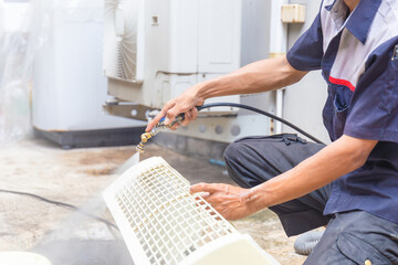 Technical man team clean air conditioning system, Repairman washing dirty cover air conditioners on...