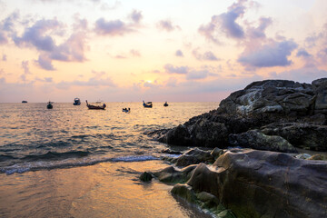 Kalim Beach and rock at twilight time sky in summer Phuket Thailand