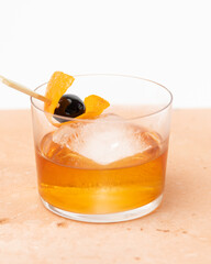 Craft Old Fashioned Cocktail with Cherry and Orange Garnish