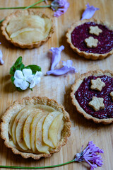Healthy oat flour tarte with cacao mousse and yogurt topped with berry and fruits