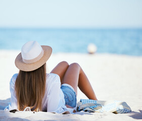 Travel, beach and woman relax by ocean for summer vacation, holiday and tropical island. Nature,...
