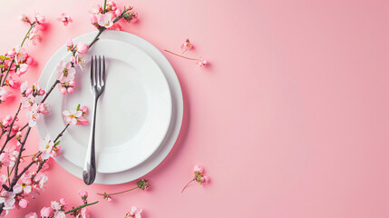Simple table setting with flowers on pink background white