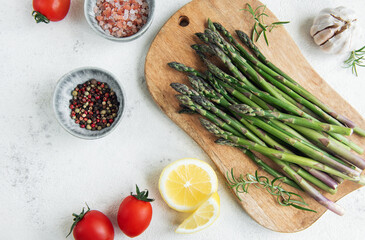 Fresh Asparagus on a Wooden Cutting Board With Seasonal Ingredients