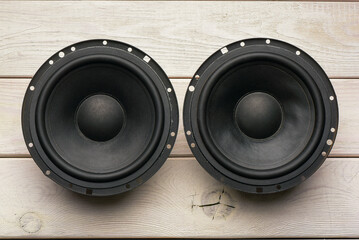 Modern car audio stereo speakers on the workbench background. Car stereo renew concept.