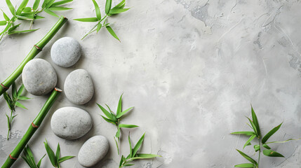Spa stones and bamboo on light background top view