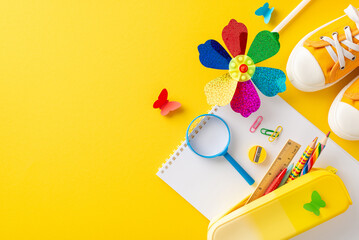 Preschool summer learning theme. Top view of educational supplies - drawing pad, crayons in case,...