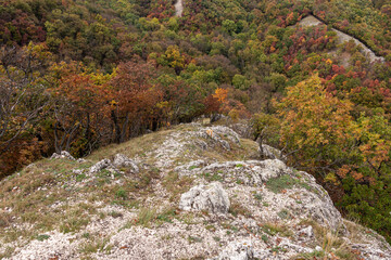 Landscape in the mountains in autumn, rock in the foreground.