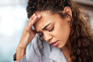 Fototapeta premium Tired, woman and headache in office for business work, stress and tension of burnout or mental health. Female employee, migraine and fatigue in workplace for overworked, anxiety and exhausted of job.