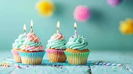 Tasty birthday cupcakes with burning candles on color