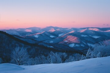 A breathtaking panorama of a snow-covered mountain range bathed in the soft pink hues of sunrise. Tranquil winter landscape capturing the beauty of nature's serenity.
